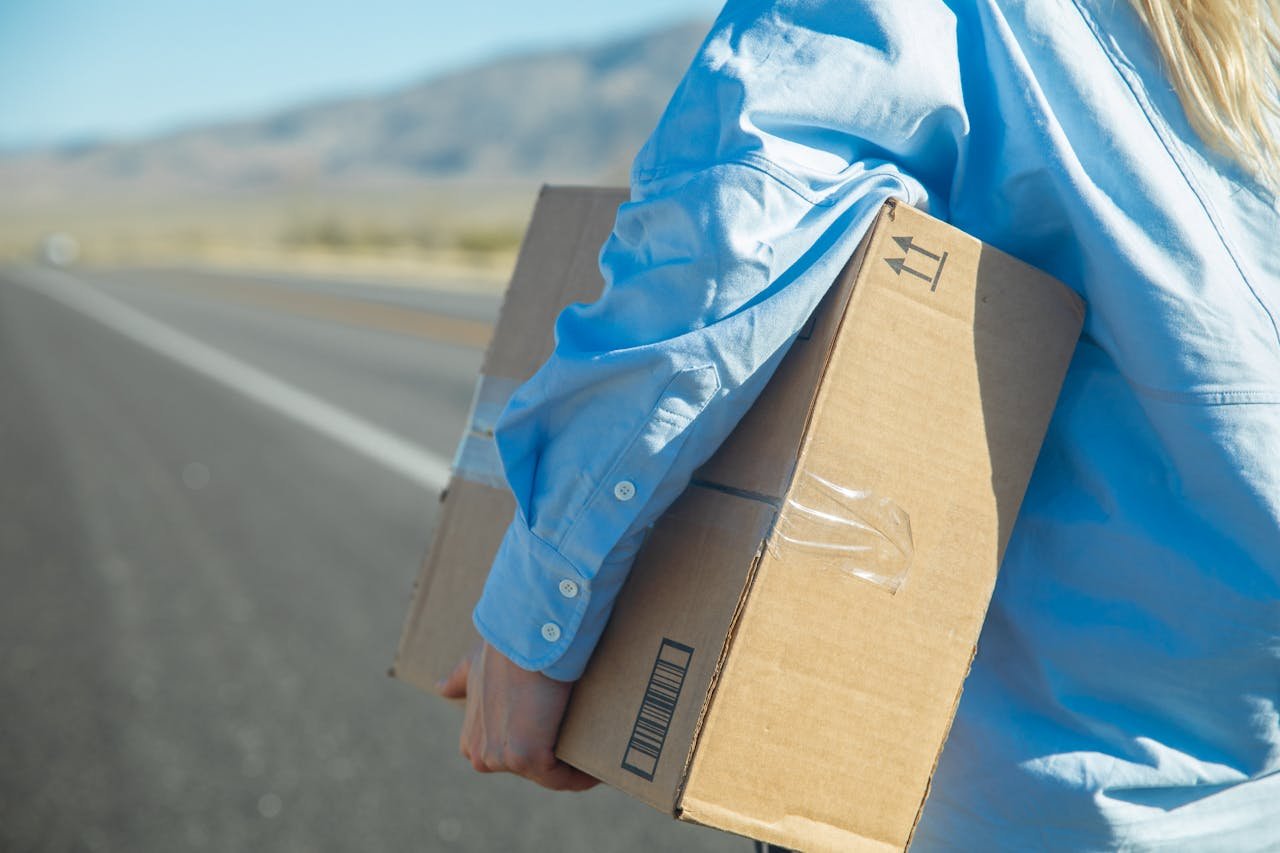 Hand Carrying Brown Cardboard Box